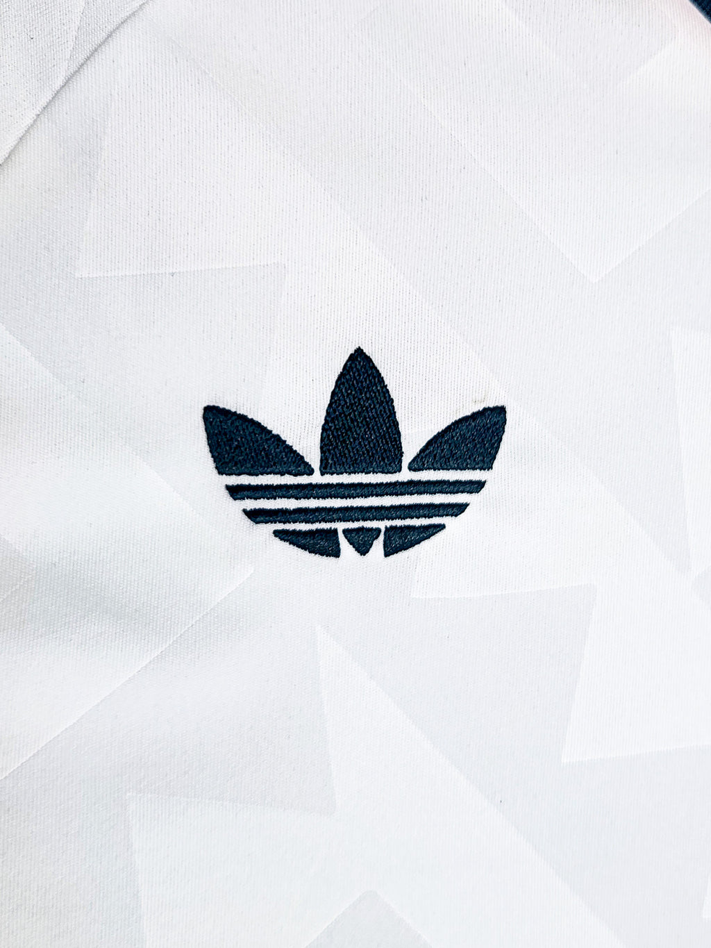 Close-up of the Mexico 2026 Adidas logo on a white background